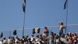 Fans cheer on their cars during the NASCAR Sprint Cup