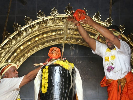 The Moorthi Abhishekam ritual of bathing the deities
