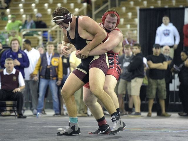 Leon junior Gabe Beyer tangles with Riverdale sophomore Cole Schneider in the FHSAA Class 2A state finals of 285-pound weight class last weekend.