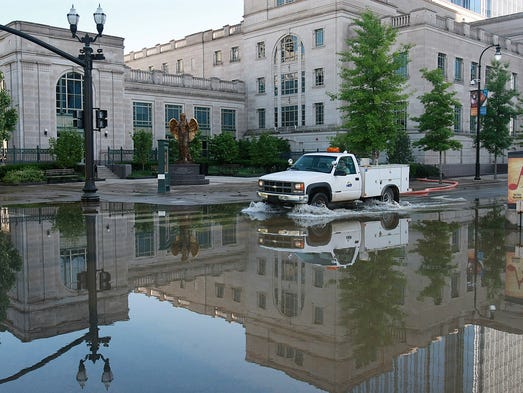 Floodwater is pumped out of the basement of the Schermerhorn