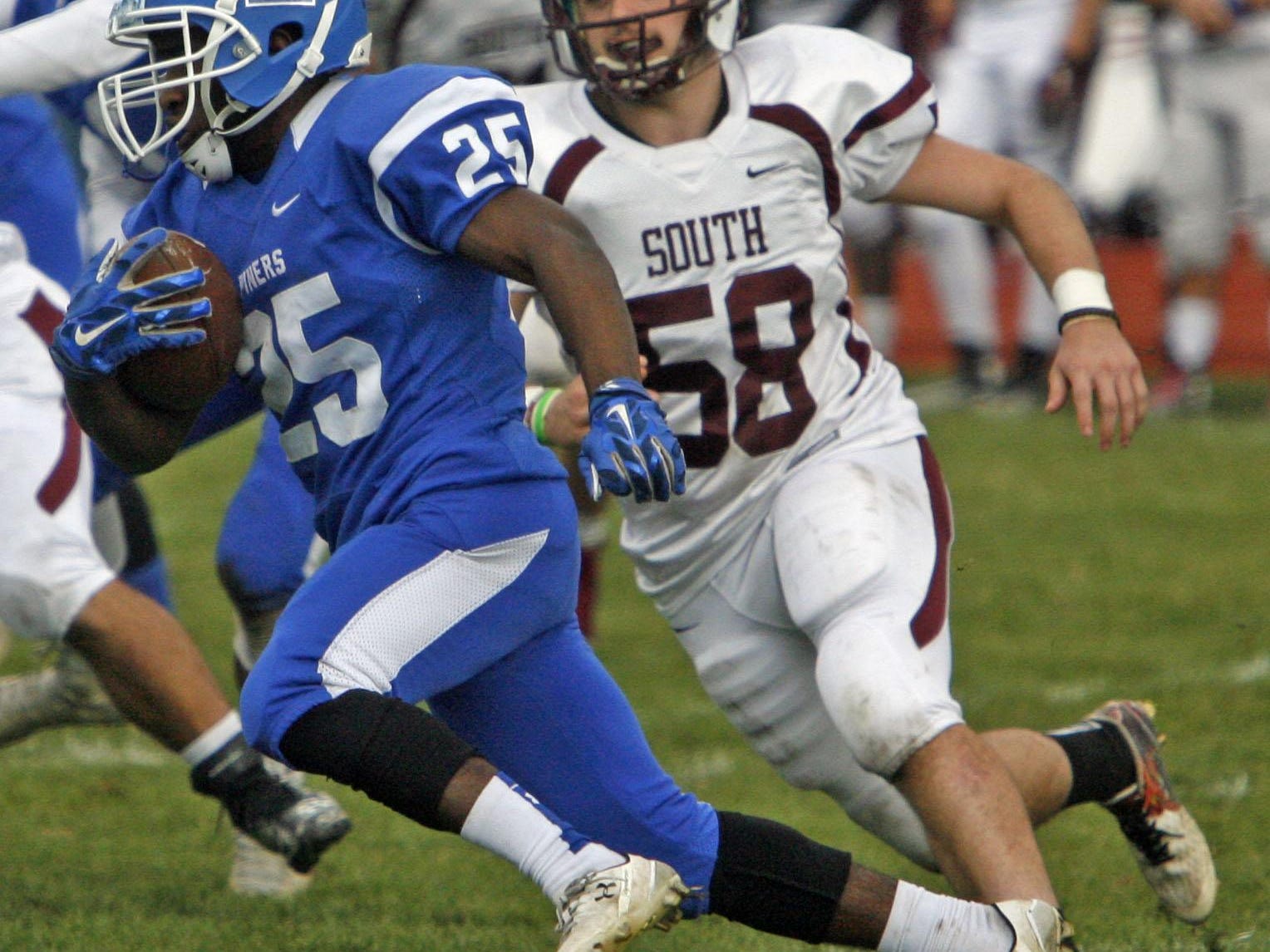 Toms River South's Michael Alfaro (58), right, pursues Lakewood's Sheldon Cobbs at Lakewood High School Nov. 26, 2015. Photo by Vincent DiSalvio / Special to The ASBURY PARK PRESS