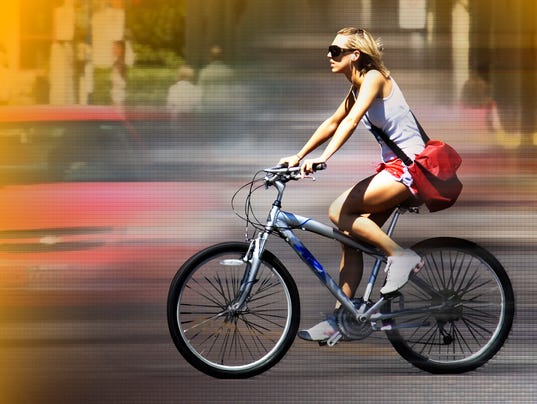 635489545522360002-woman-bicycle-bicyclist-AP