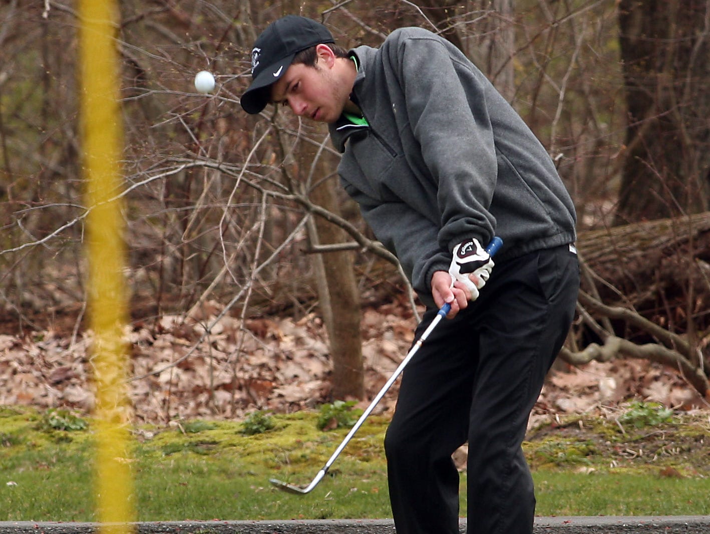 Nick Axelson of Roxbury chips onto the green during Morris County Tournament golf at Flanders Valley Golf Course April 23, 2015. Flanders, N.J. Bob Karp/Staff Photographer.