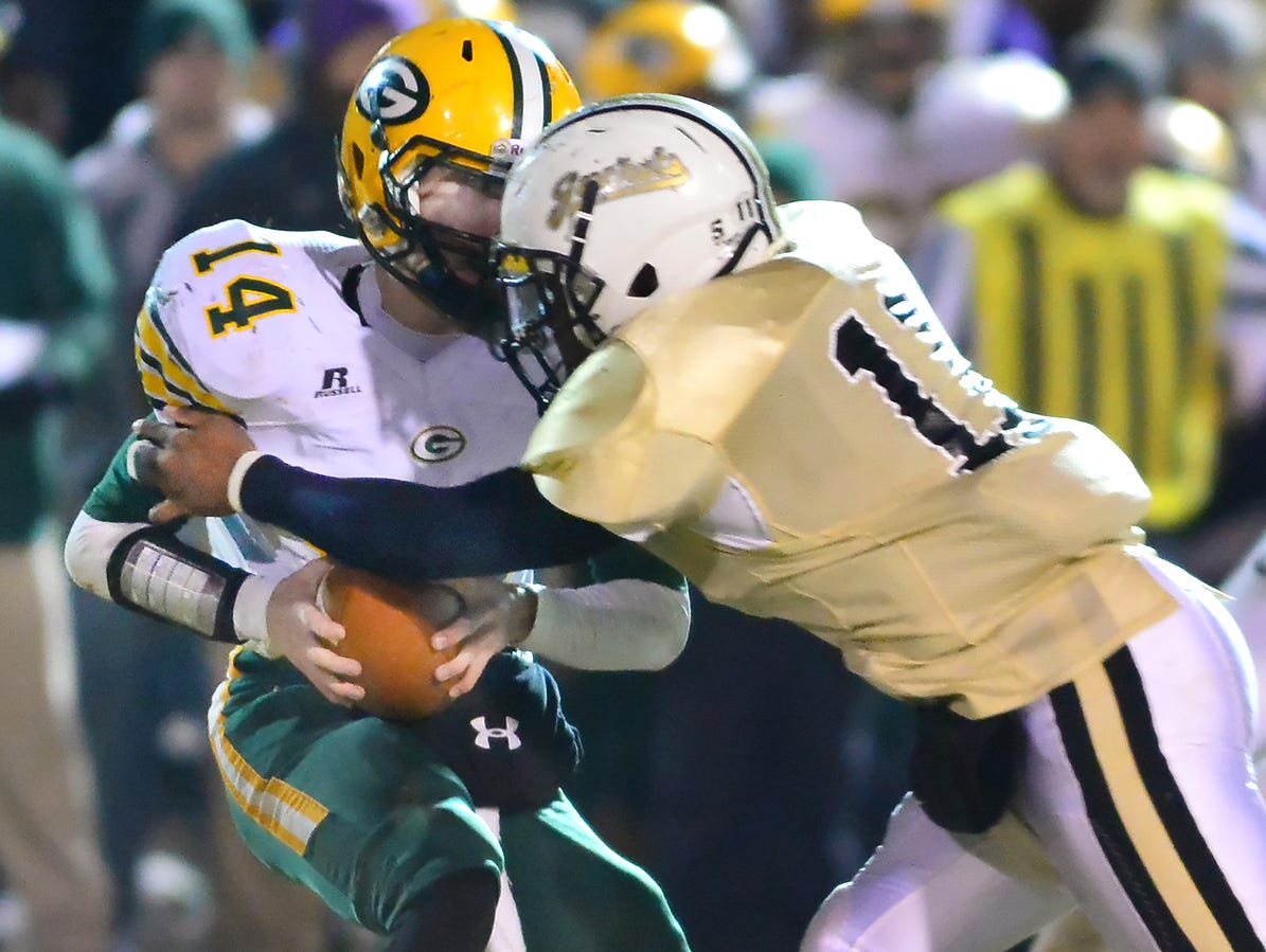 Springfield's Markeith Lawson (right) makes a tackle during a 2014 game.