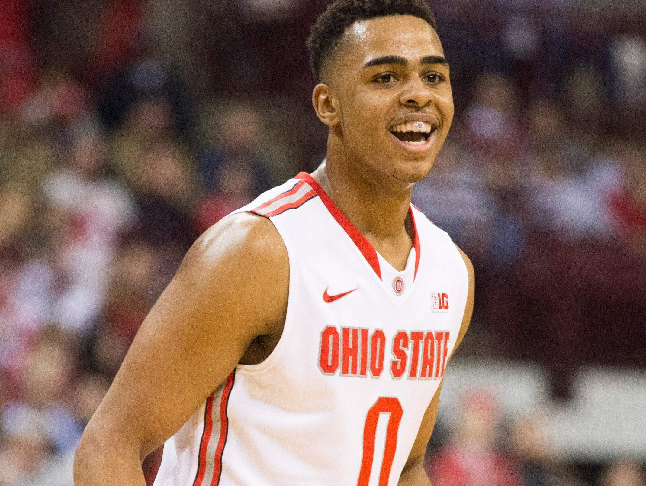 Ohio State Buckeyes guard D'Angelo Russell reacts after hitting a 3-point shot against the Marquette this past season. The Louisville native is set to become an early selection in Thursday's NBA draft.