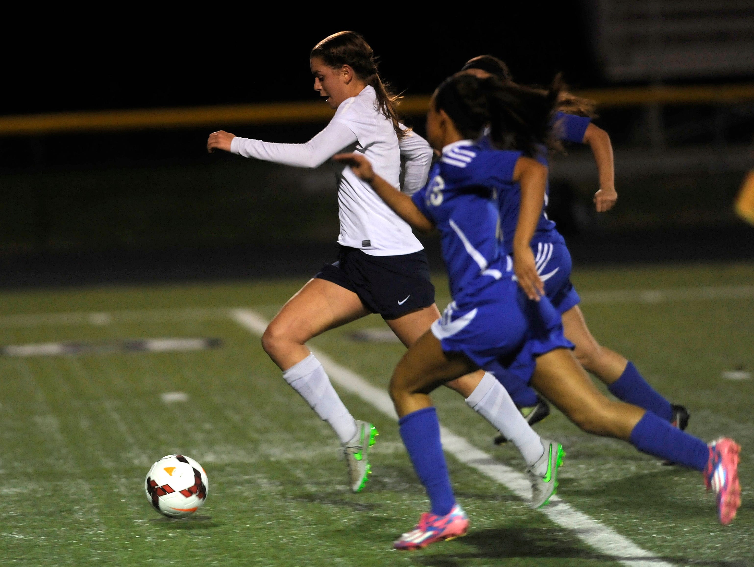 Granville's Rose Sawyers breaks away from Chillicothe defenders to score her third goal during Tuesday night's Division II regional semifinal game at Bloom-Carroll. The Blue Aces defeated Chillicothe 8-0.