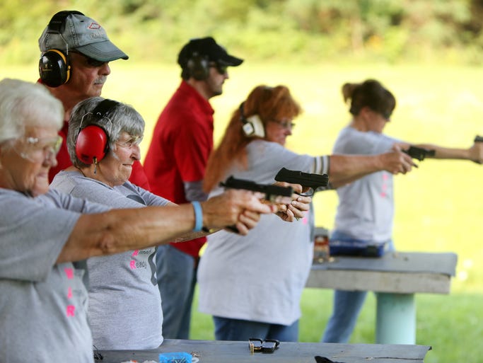 Members of the 'Women Armed and Ready' gun club take target practice at the Laughery Valley Fish and Game Shooting Range in Versailles. The new club was started by Konnie Couch and Robin Willoughby in May. Giving instruction are Dale Reatherford, owner of Whitewater Valley Firearms Training and part-time Springdale police officer, left, and Brandon Vornauf, one of the firearms trainers. Barb Maness, 75, second from left, uses a Ruger LCP .380. She has her Indiana concealed-carry license and is getting her Florida concealed-carry license to allow her to carry in additional states. She said she wanted to learn to shoot for safety reasons after her husband passed away three years ago. She lives in rural Indiana. She said, "I've been shooting for about two years. I'm surprised at how accurate I am."