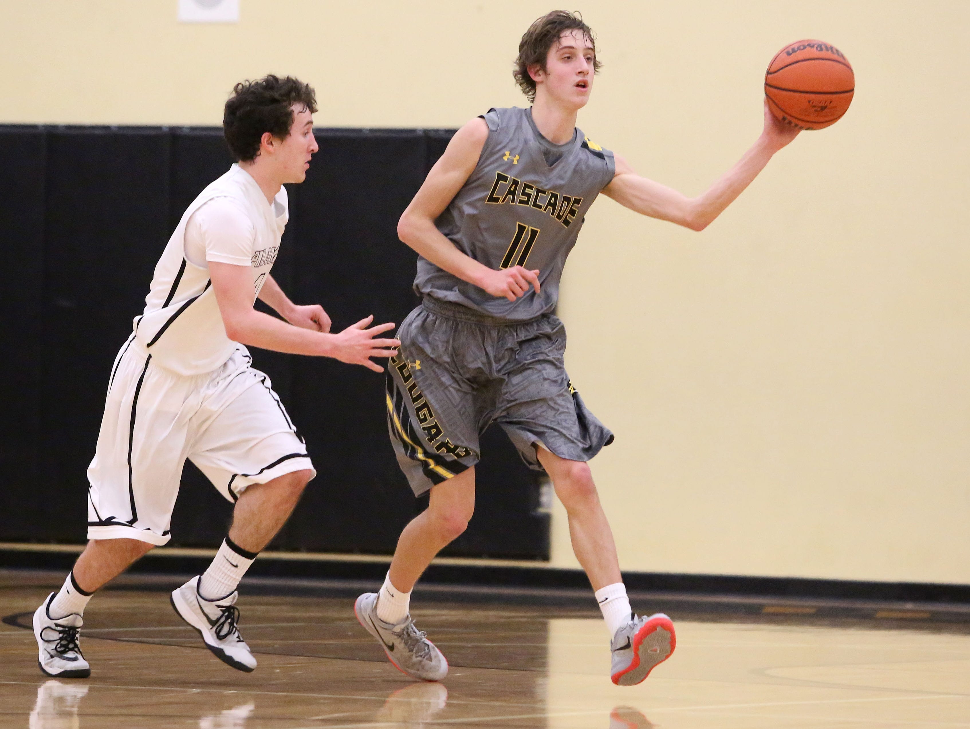 Cascade's John Schirmer (11) makes a pass during their game on Friday, Feb. 6 , 2015, in Philomath, Ore.