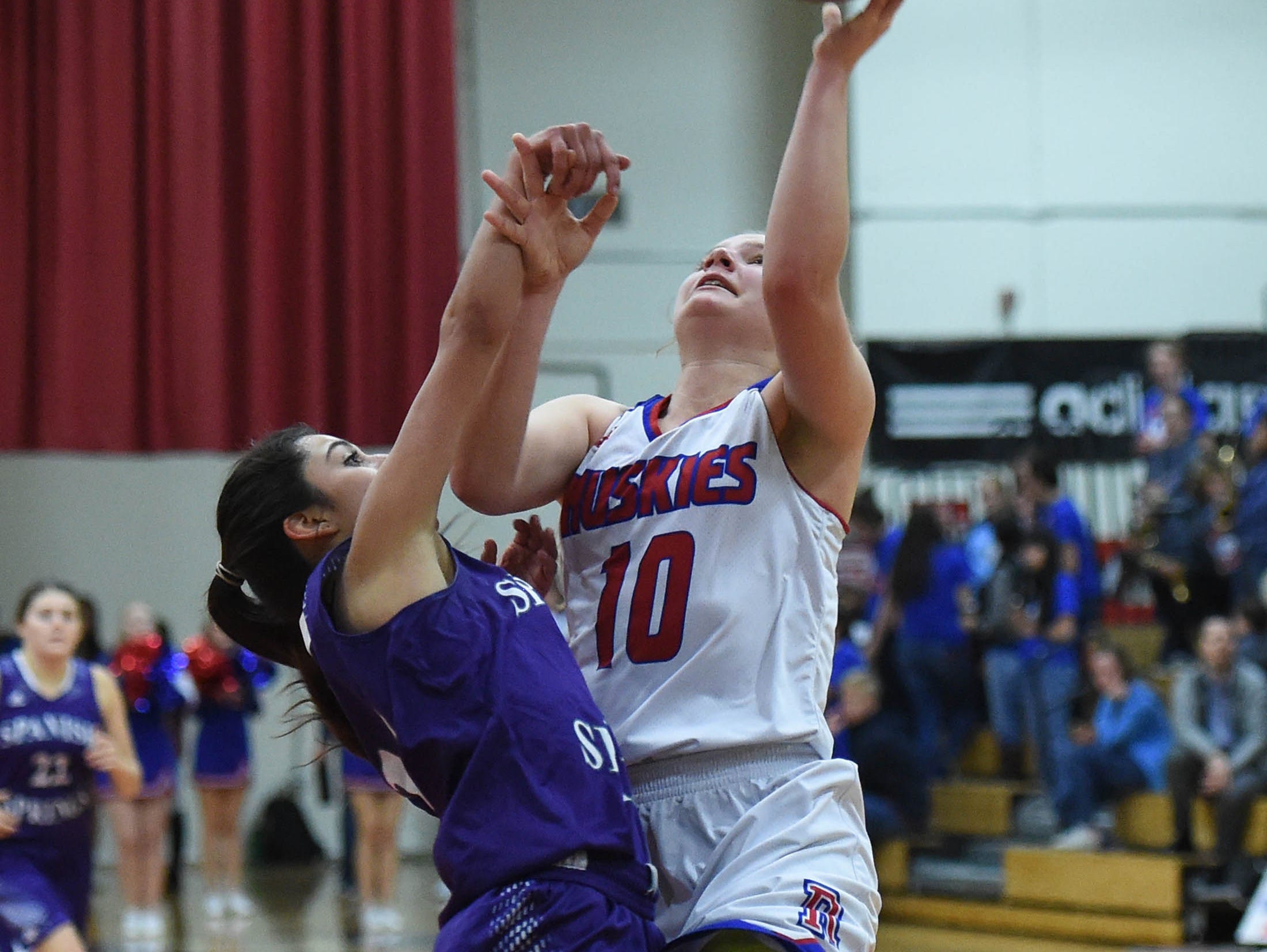 Reno's Dominigue Harding shoots with with Spanish Springs' Naelia Pinedo covering her in Tuesday's game at Reno High.