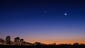 The moon and Venus rise over Dunnellon, Fla., as the