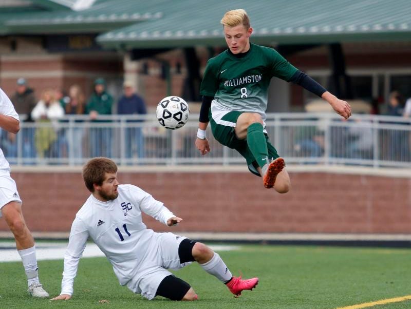Williamston's Brian Ganton (8) and Grand Rapids South Christian's Matt VanderHill (11) battle during the MHSAA Division 3 Championship game Saturday, Nov. 7, 2015, in Comstock Park, Mich. After playing to a scoreless tie through overtime, Williamston fell in a shootout.