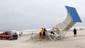 Lifeguards and firefighters take down a lifeguard stand at Atlantic Beach, N.C., to prevent it from being damaged by Hurricane Arthur.