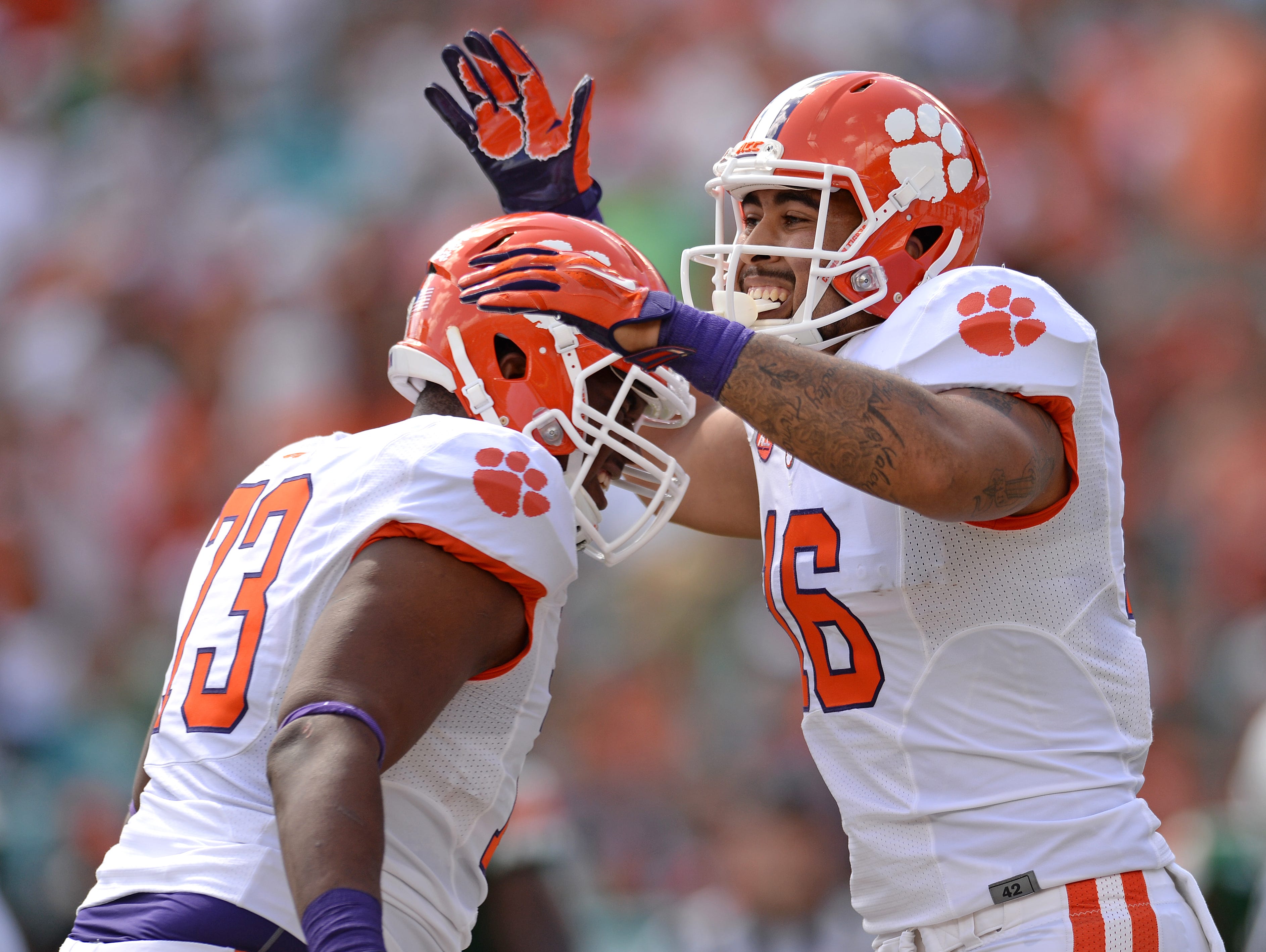 Clemson tight end Jordan Leggett (16) celebrates with offensive tackle Joe Gore (73) after scoring on a 34 yard reception against Miami during the 1st quarter Saturday, Oct. 24, 2015, in Miami Gardens, Fla. The TD was Leggett's 5th TD in 5 consecutive games.