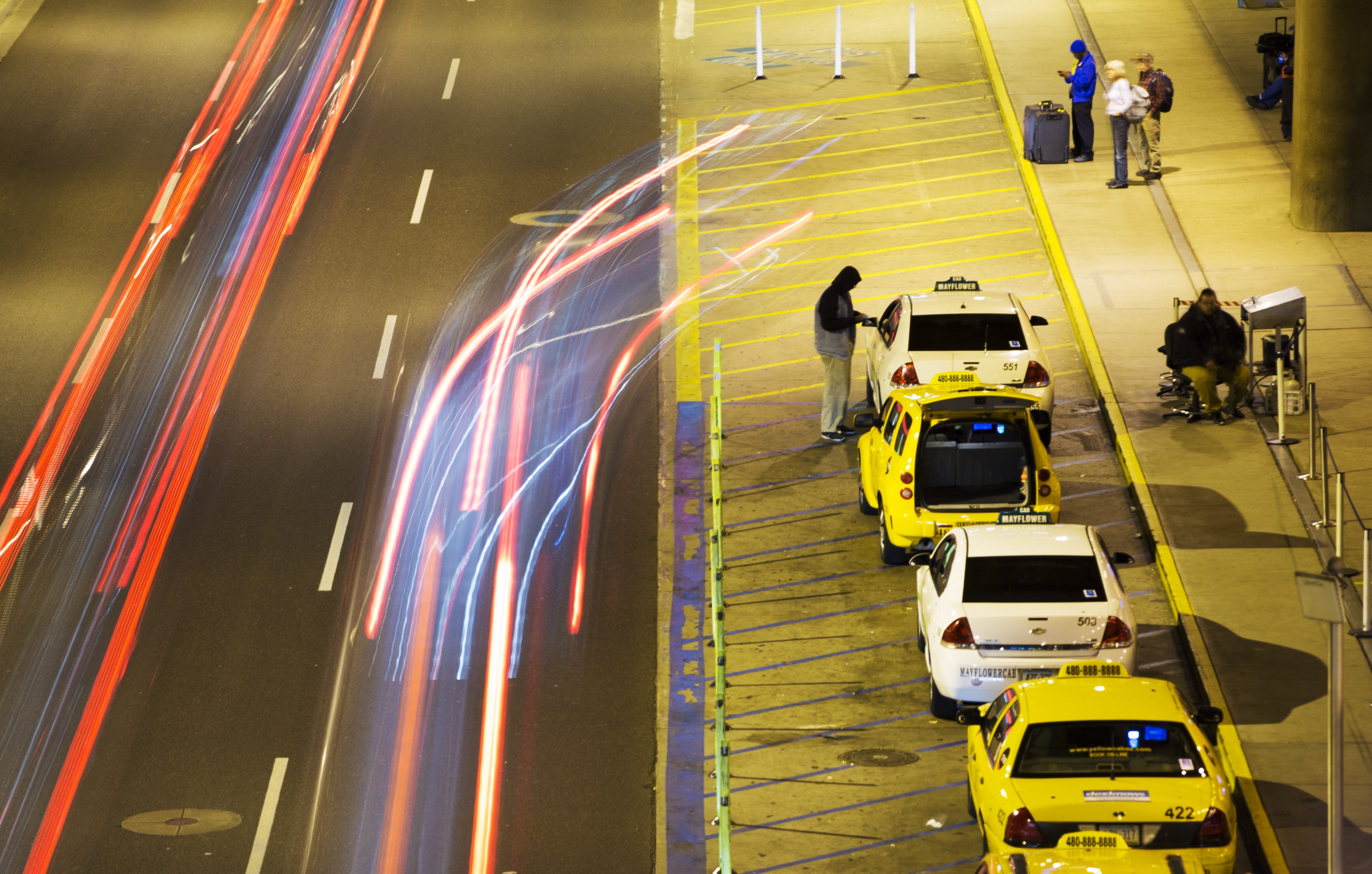 Taxis wait to pick up passengers at Phoenix Sky Harbor