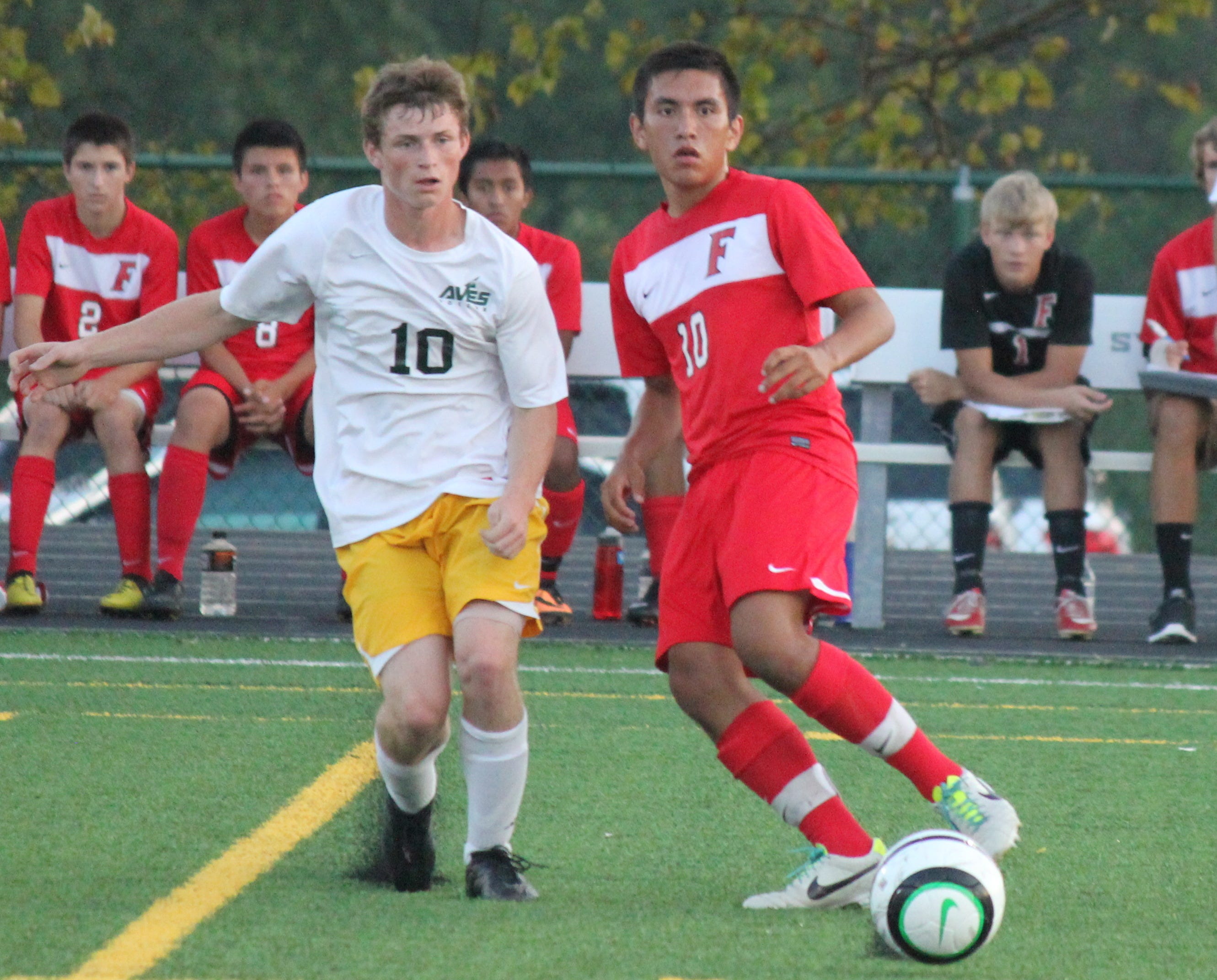 Sycamore forward Brennon Shanks and Fairfield’s Yardley Gonzalez watch the flight of the ball as it goes toward teammates last September.