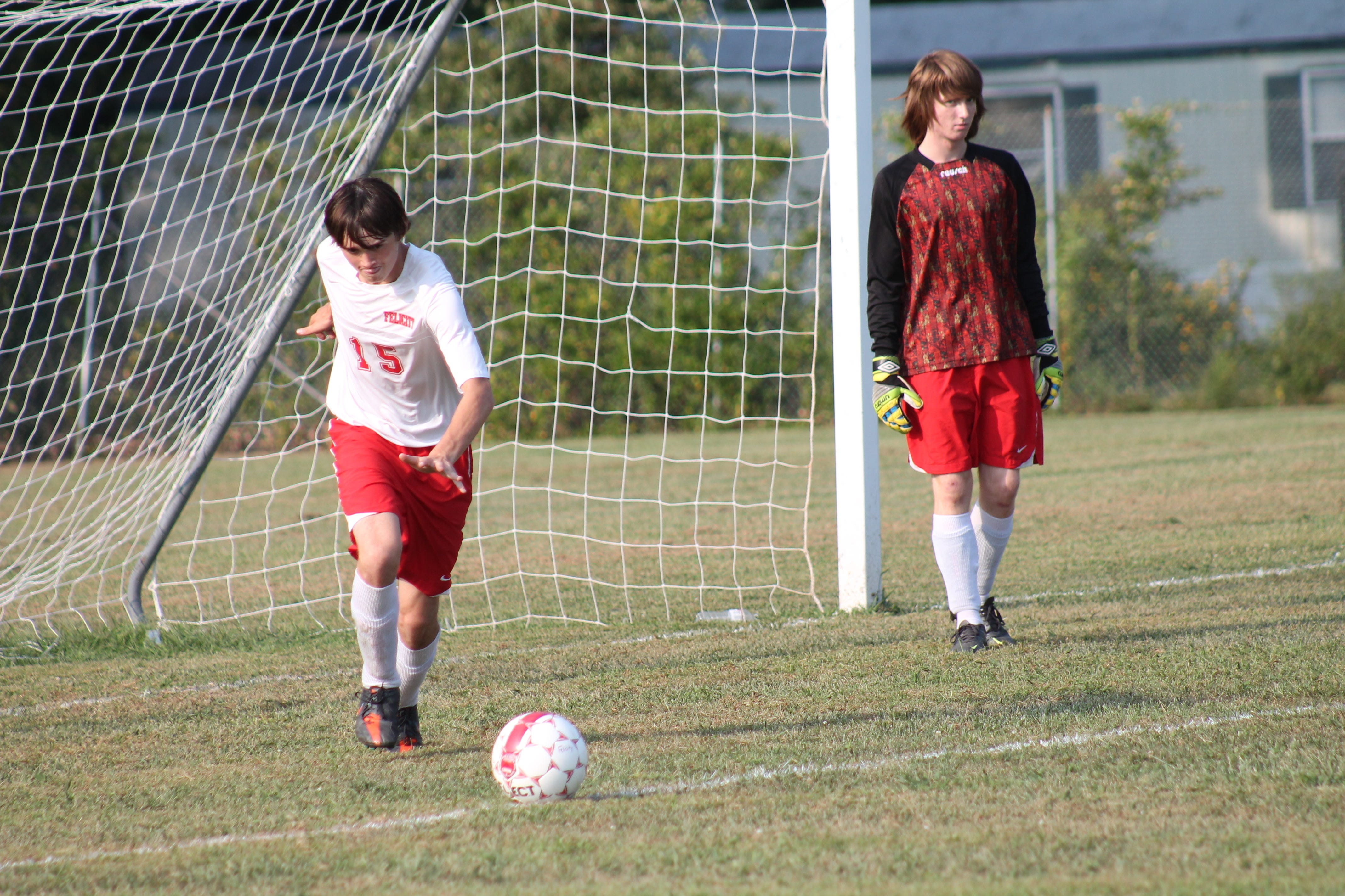 Kyle Lauderback takes the goal kick for Felicity-Franklin against Amelia last September as keeper Jared Tackett stands to the right.