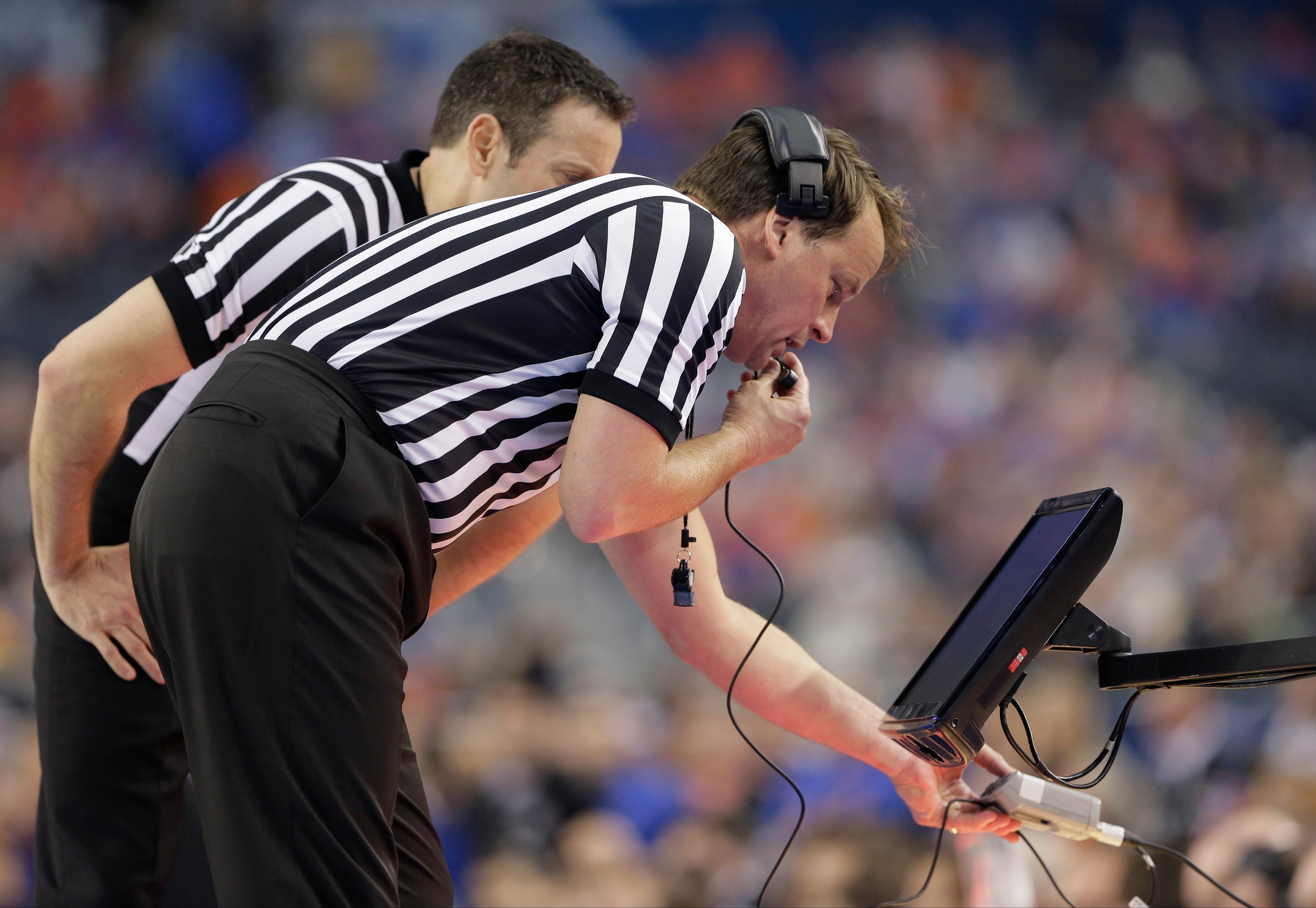 Video replay transforms end of NCAA basketball games into marathon