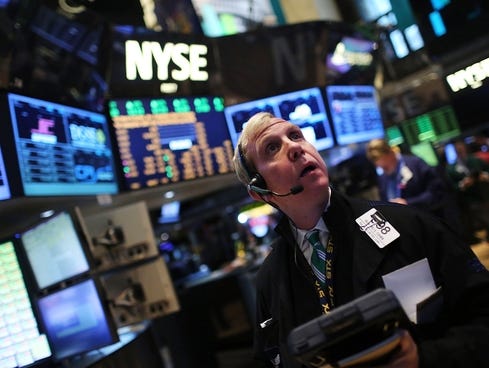 traders work on the floor of the new york stock