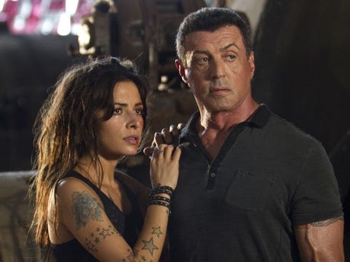 Sarah Shahi, left, and Sylvester Stallone star in the gory and poorly 