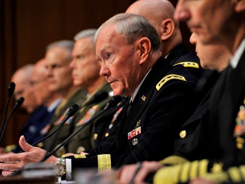 General Martin Dempsey, chairman of the Joint Chiefs of Staff, gives his opening statement sitting with the rest of the Joint Chiefs at a hearing on military sexual assaults before the Senate Committee on Armed Services.