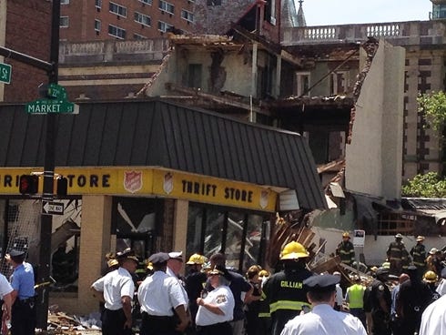 Emergency personnel respond to a building collapse in downtown Philadelphia on June 5, 2013.