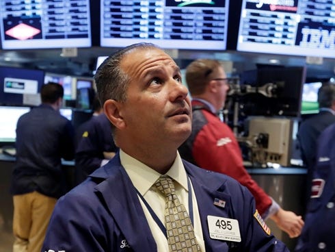 Trader Joel Luchese works on the floor of the New York Stock Exchange Tuesday, May 28, 2013. A jump in home prices is helping send the stock market sharply higher in early trading. (AP Photo/Richard Drew)  ORG XMIT: NYRD103