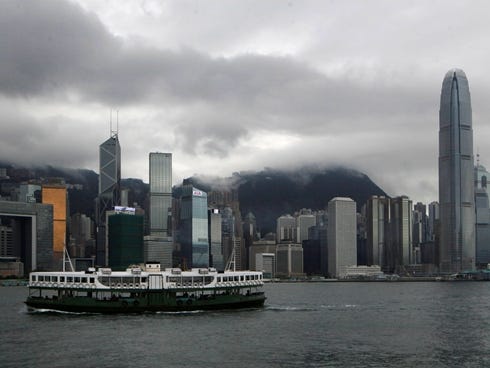 A ferry sails across the Victoria Harbour in Hong Kong on Tuesday, June 11, 2013.