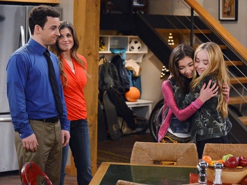 The 'Girl Meets World' cast features Ben Savage, left, and Danielle Fishel. They are joined by Rowan Blanchard and Sabrina Carpenter as their daughter and her best friend.