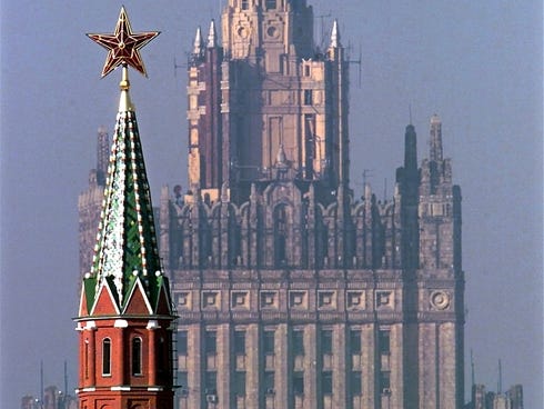 Russia's Foreign Ministry building (back) with one of Kremlin towers (front) rising in central Moscow.