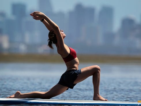 Yoga Today on Yoga Instructor Sarah Henry Leads A Class During A Paddleboard Yoga