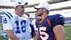 Then-Colts quarterback Peyton Manning (18) greets then-Broncos QB Tim Tebow (15) at their Sept. 26, 2010 game in Denver. The following offseason, Manning would sign with the Broncos as a free agent, meaning Tebow's days in Denver were numbered.