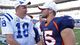 Then-Colts quarterback Peyton Manning (18) greets then-Broncos QB Tim Tebow (15) at their Sept. 26, 2010 game in Denver. The following offseason, Manning would sign with the Broncos as a free agent, meaning Tebow's days in Denver were numbered.
