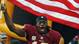 Robert Griffin III (10) waves an American flag for Military Appreciation as he is introduced before a game against the Eagles at FedEX Field.