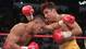 Camacho and De La Hoya trade blows during their 1997 title fight, with De La Hoya won.