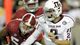 Manziel scrambles out of the pocket under pressure from the Alabama defense during the fourth quarter at Bryant Denny Stadium.