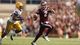 Manziel scrambles from LSU linebacker Kevin Minter.