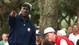 Chicago Bulls NBA star Michael Jordan points as he watches the United States fourball pairing of Mark O'Meara and Tiger Woods with US captain Tom Kite on day two of the Ryder Cup at Valderrama golf course Saturday Sept. 27, 1997.