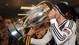 Beckham drinks out of the MLS Cup trophy after the Galaxy's 3-1 win over the Houston Dynamo.