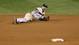 The Yankees' Derek Jeter falls to the ground with an injured ankle in the top of the 12th inning against the Detroit Tigers during Game One of the ALCS at Yankee Stadium.
