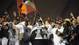 Virginia Tech players take the stage with their trophy after defeating  Rutgers 13-10 in the Russell Athletic Bowl.