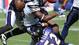 San Diego Chargers tight end Antonio Gates (85) loses control of the ball when he is hit by Baltimore Ravens safety Bawan Landry (26) and linebacker Ray Lewis (52) during the second quarter against the  at Qualcomm Stadium.