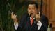 Venezuelan President Hugo Chavez holds up pistols belonging to independence hero Simon Bolivar during a ceremony marking the 229th anniversary of Bolivar's birth on July 24, 2012, at Miraflores presidential palace in Caracas.  Bolivar is the namesake of Chavez's Bolivarian Revolution movement and his government was completing a new mausoleum to house Bolivar's remains.