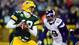 Packers quarterback Aaron Rodgers (12) is pressured by Vikings defensive end Jared Allen (69) in the first quarter.
