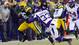 Packers running back DuJuan Harris (26) carries the football as Minnesota Vikings safety Jamarca Sanford (33) defends during the first quarter.