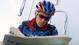 Lance Armstrong reads a French sports newspaper before a training session in Nantes, France, two days before the start of the 86th Tour de France in 1999.