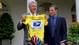 President  Bill Clinton holds up a yellow US  Postal Service jersey given to him by Lance Armstrong in the Rose Garden of the White House in 1999.