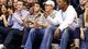 Johnny Manziel (with white cap) sits courtside for the game between the Dallas Mavericks and Miami Heat at the American Airlines Center.