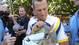 Lance Armstrong holds a baby kangaroo as he speaks with the media before stage two of the 2009 Tour Down Under.