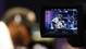 Baltimore Ravens inside linebacker Ray Lewis is seen through the video screen of a camera during media day in preparation for Super Bowl XLVII against the San Francisco 49ers at the Mercedes-Benz Superdome.