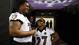 Baltimore Ravens running back Ray Rice (27) and tackle Bryant McKinnie (78) stand in the tunnel as they wait for the start of media day in preparation for Super Bowl XLVII against the San Francisco 49ers at the Mercedes-Benz Superdome.